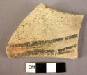 Potsherd - lustrous paint on coarse ware