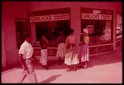 Women standing in front of a store