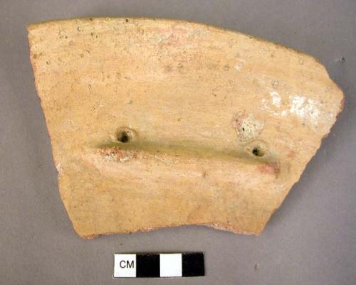 Rim potsherd with a lug handle