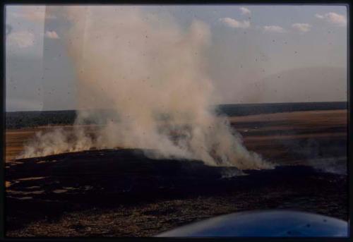 Aerial view of area between Andara and Nova Lisboa, showing smoke from a fire