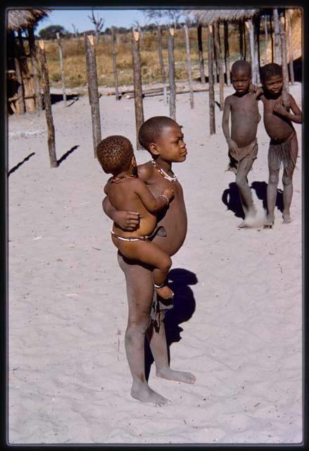 Girl holding a baby