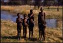 Girls standing by the river