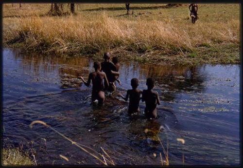 Group of girls playing in the river