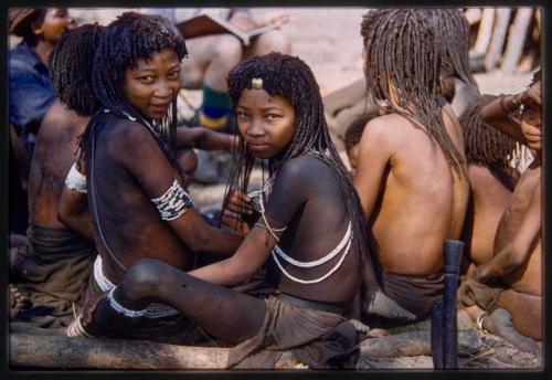 Group of women and children sitting