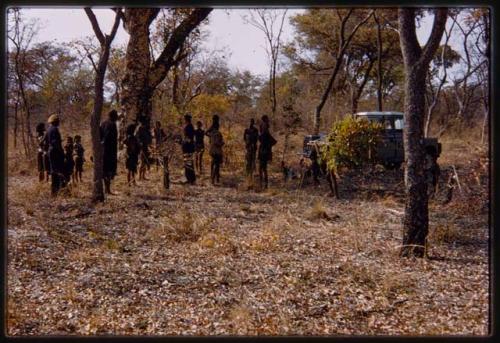 People standing next to the expedition Land Rover