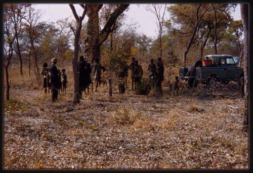 People standing next to the expedition Land Rover