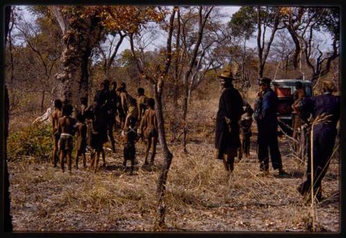 People standing next to the expedition Land Rover