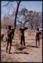 Men carrying buffalo meat