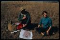 Elsa Dziomba and Dr. Friede making a rubbing on a stone