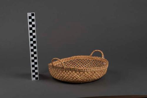 Basketry bowl with openwork and two small handles