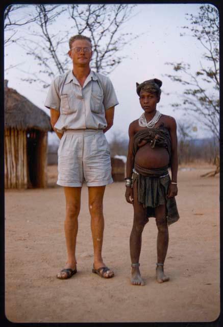 Woman standing with Mr. Prinsloo, a farmer