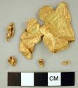 Metal, embossed gold sheet, very thin, w. fragments