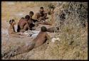 Groups: Group of men and boys sitting and lying down