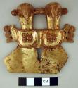One gold plated copper shield with penguin shaped figures
