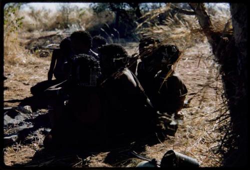 Groups: Women and girls sitting closely together