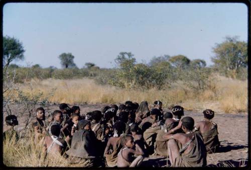 Groups, Song Recording: Large group of women sitting closely together, gathered to make a sound recording of dance songs