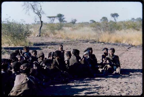 Groups, Song Recording: Large group of women sitting closely together, gathered to make a sound recording of dance songs