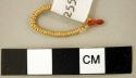 Short strand ot tiny gold beads; .2 cm average diameter, .1 cm average length