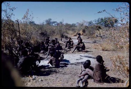 Groups, Extended Family: People sitting in "Gao Hunchback's" dwelling place