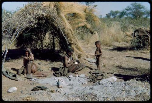 Groups, Extended Family: Be and Khuan//a (wives of Gau) sitting in front of a skerm