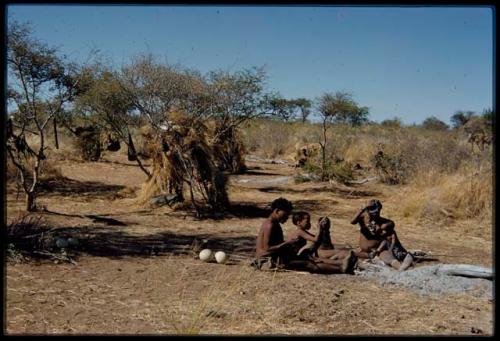 Groups, "Nuclear Family": ≠Toma working on arrows, sitting with !U and their children