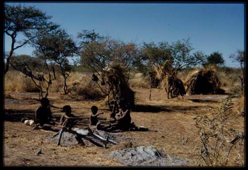 Groups, "Nuclear Family": ≠Toma holding an arrow, sitting with !U and their children