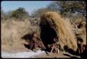 Groups, "Nuclear Family": Tsamgao and Bau (daughter of /Ti!kay) sitting in front of a skerm