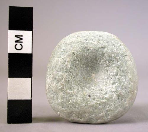 Unfinished stone spindle whorl