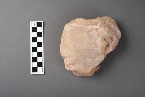 Fragment of a large pottery figurine with a small child in arm