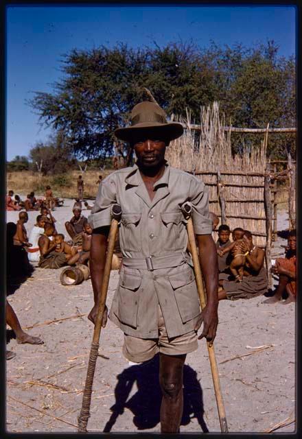 Man standing with crutches