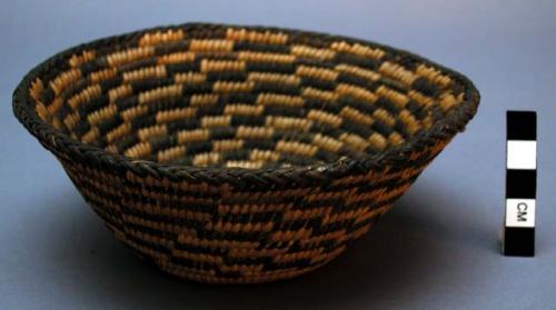 Basket, coiled. Geometric designs.