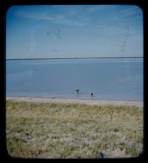 Two men in the water at Thinthuma Pan