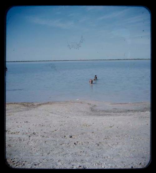 Two men bathing at Thinthuma Pan