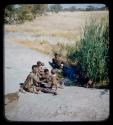 Group of women (including !U and Norna) sitting at waterhole