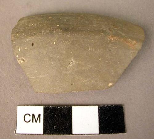 Fragment of thin, hard pottery bowl - gray, unslipped, burnished