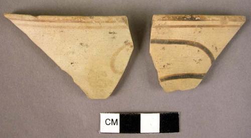 2 rim potsherds - conventionalized naturalistic forms