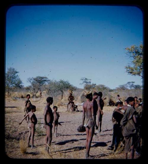 Group of people standing for a curing dance