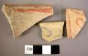 3 pottery fragments of conventionalised naturalistic patterns