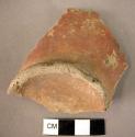 Pottery base fragment - red slipped, unburnished ware