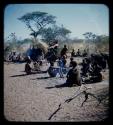 Group of people sitting, including a girl with a //guashi