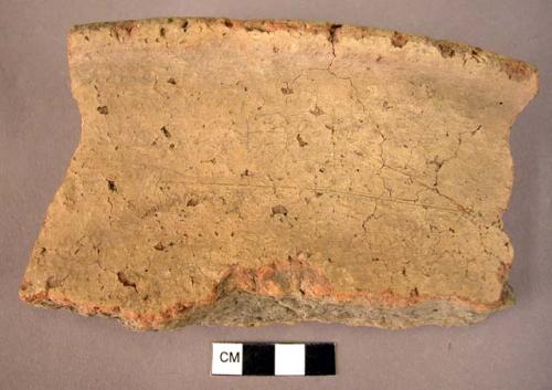 Pottery pithos rim fragment, buff, slipped