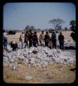 Expedition members and a group of people standing