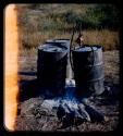Water barrels on top of an extinguished fire