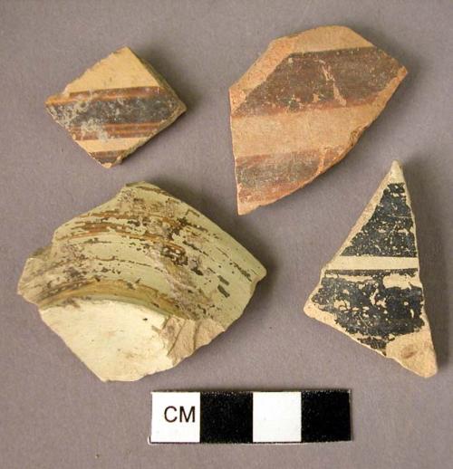 22 potsherds; 1 base fragment - Mycenaean painted bands - black paint