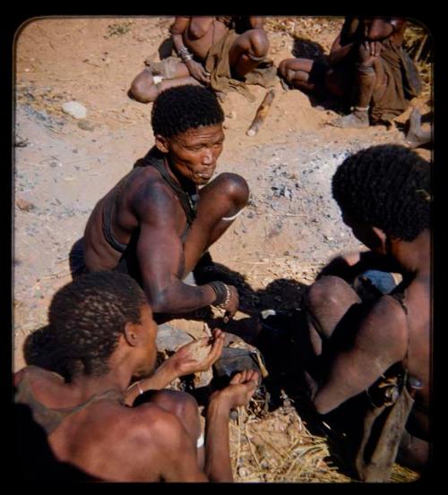 Food, Eating: Men sitting and eating, close-up