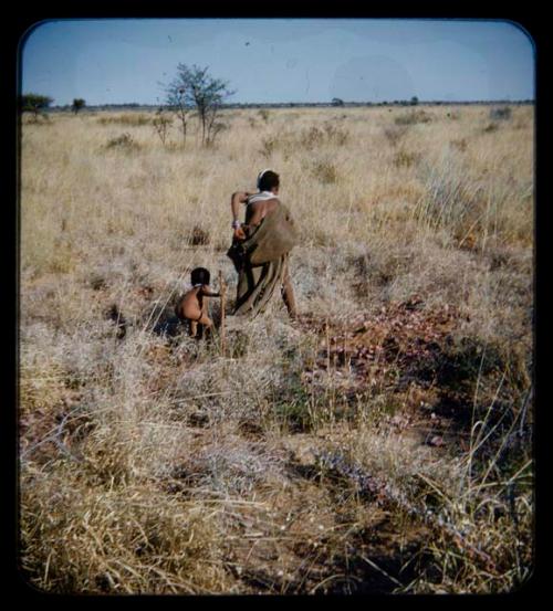 Food Gathering, Men: Mother and her child gathering in grass