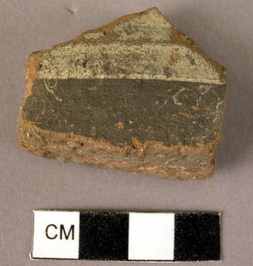 Potsherd - light bands on coarse dark ware - local copy of Middle Minoan