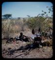 Groups, Song Recording: Woman lying on ground, with her belongings and ostrich eggs nearby