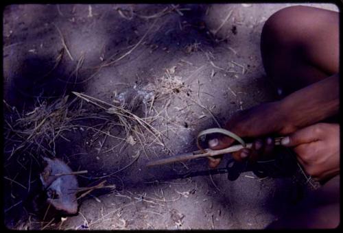 Someone's hands holding a handmade toy gun