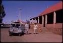 Two people standing outside a hotel in Kuruman